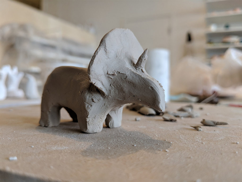 Sculpting clay animals : a triceratops