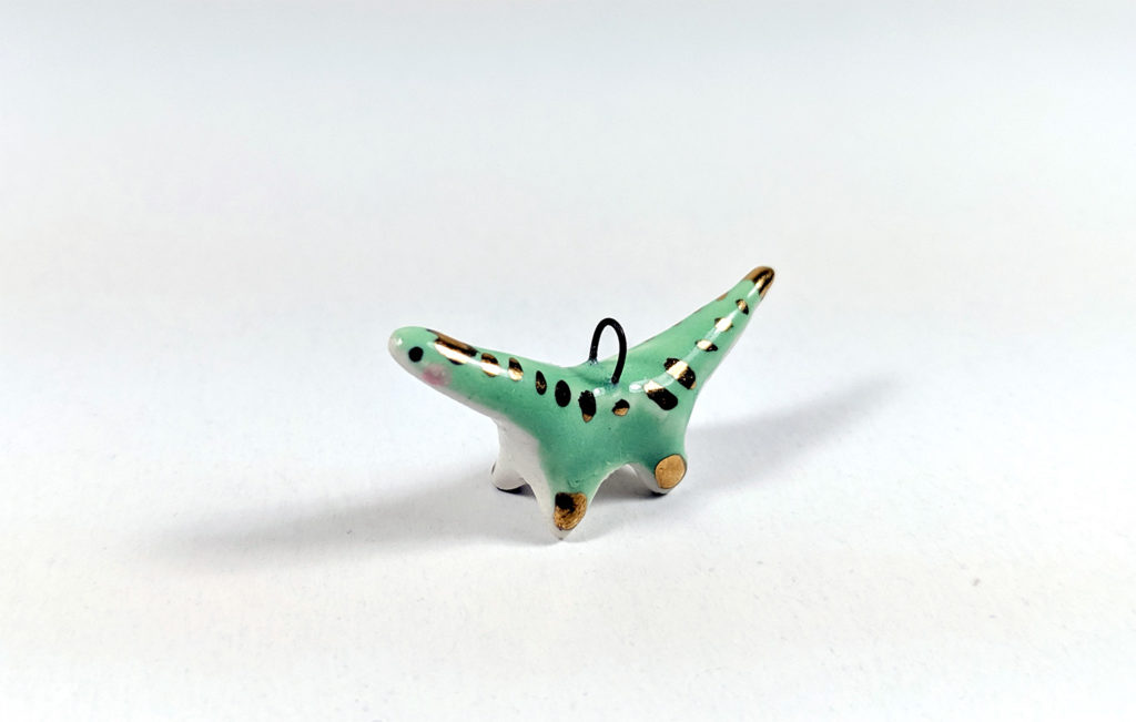 ceramic diplodocus gold pendant