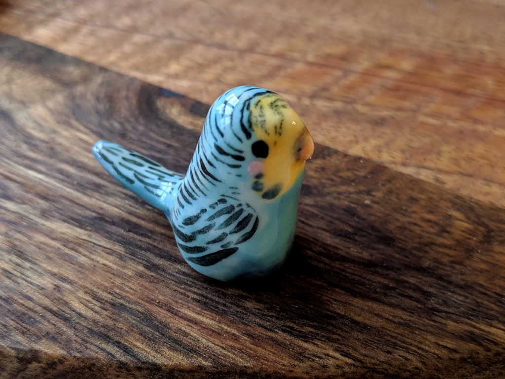 blue parakeet ceramic figure