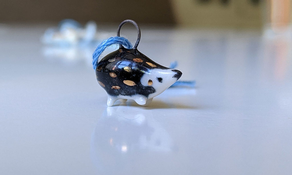 hedgehog pendant gold and ceramics