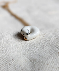 Winter stoat ceramics and gold pendant