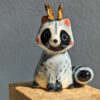 antlered raccoon porcelain figurine