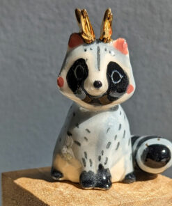 antlered raccoon porcelain figurine