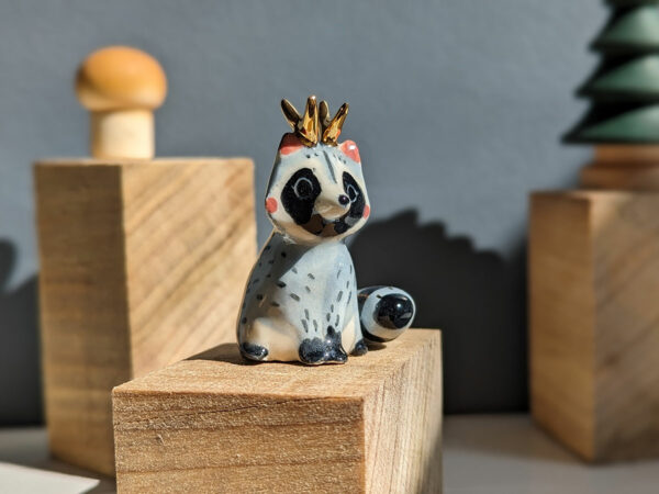 antlered raccoon porcelain figurine