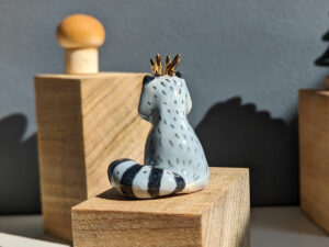 antlered raccoon porcelain figurine