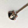 cute raccoon portrait pendant