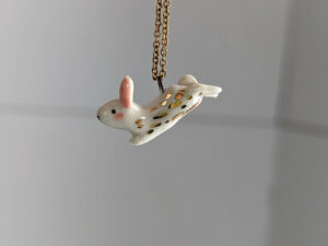 cute bunny porcelain pendant in gold and white