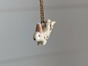 cute bunny porcelain pendant in gold and white