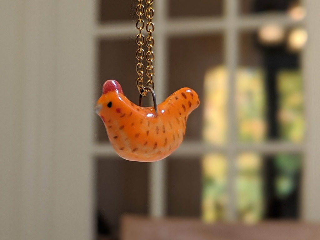 poule rousse pendentif