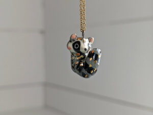 porcelain raccoon pendant