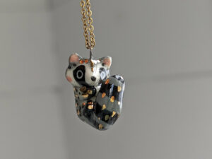 porcelain raccoon pendant