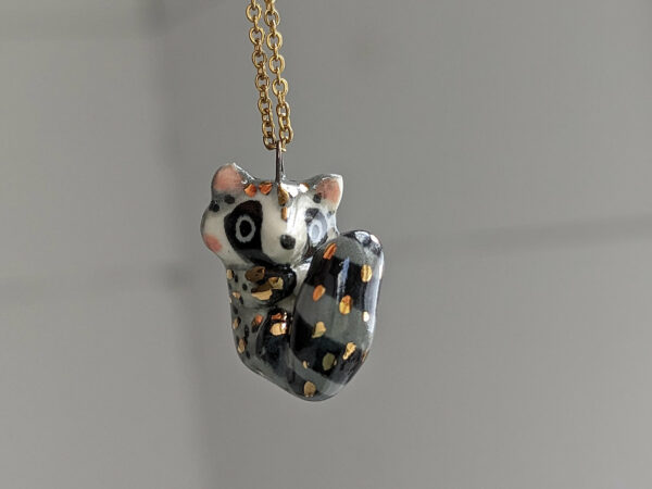 porcelain raccoon pendant