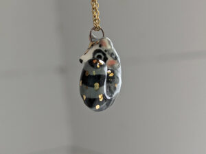 porcelain raccoon pendant