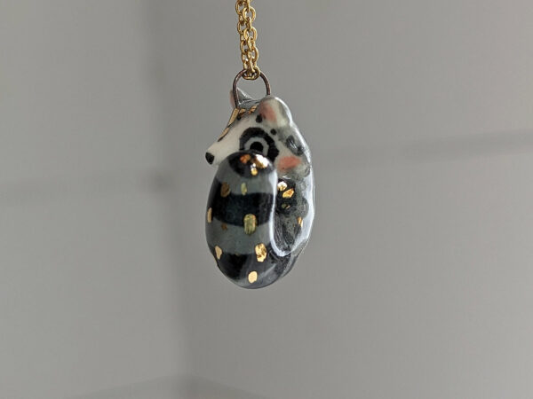porcelain raccoon pendant