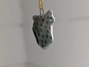 porcelain raccoon pendant