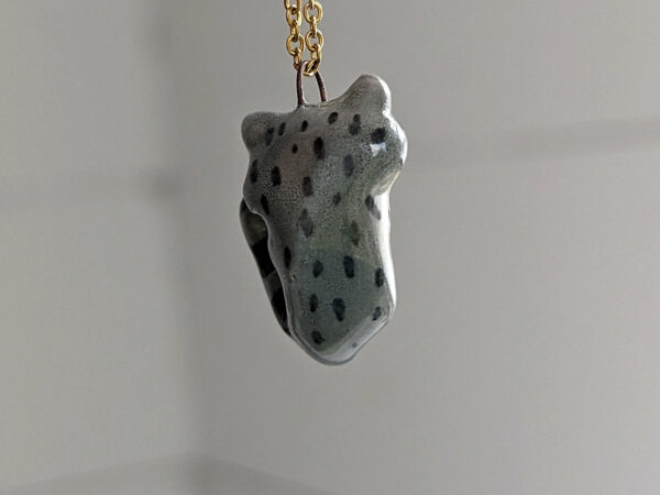 porcelain raccoon pendant