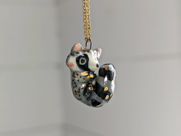 porcelain raccoon pendant