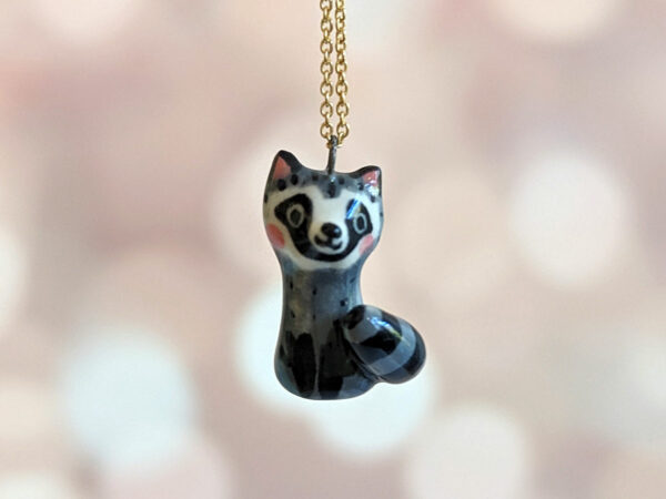 porcelain raccoon pendant