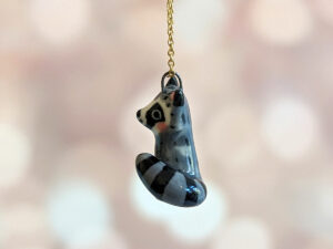 porcelain raccoon pendant