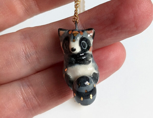 porcelain raccoon pendant