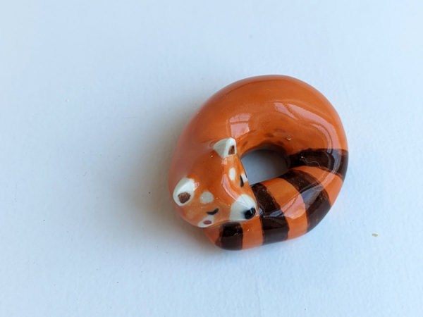 porcelain red panda figurine