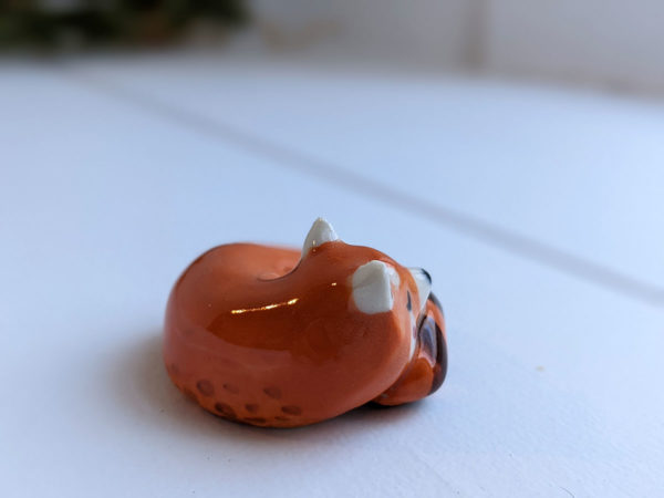 porcelain red panda figurine