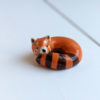 porcelain red panda figurine