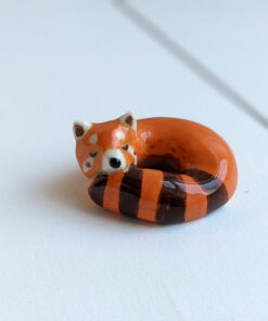 porcelain red panda figurine