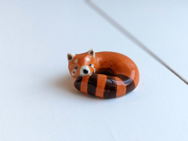 porcelain red panda figurine