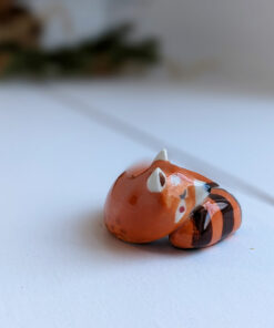 porcelain red panda figurine