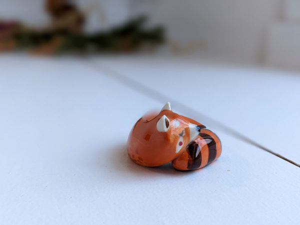 porcelain red panda figurine