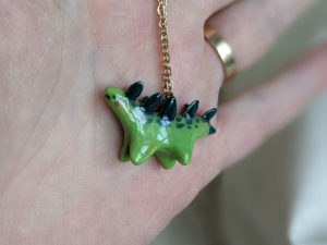 green stegosaurus pendant