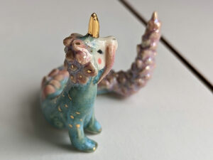 cute east dragon porcelain figurine in blue pink and gold