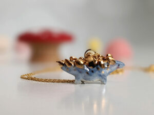 stegosaurus pendant blue