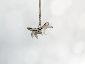 porcelain raptor pendant