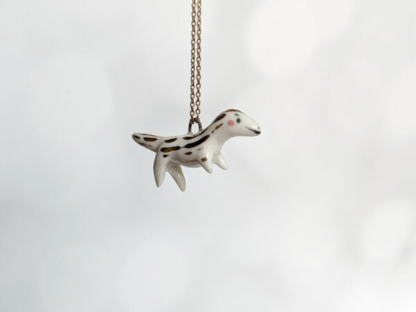 porcelain raptor pendant