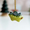 green stegosaurus pendant