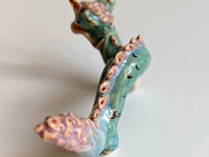 cute east dragon porcelain figurine in blue pink and gold