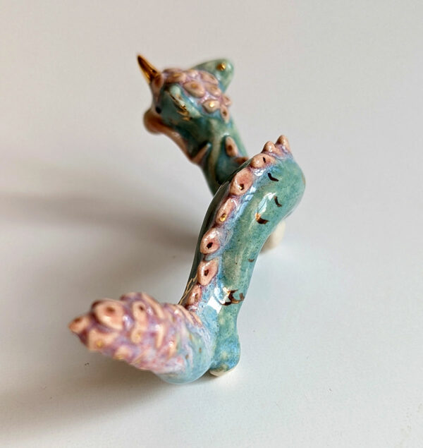 cute east dragon porcelain figurine in blue pink and gold