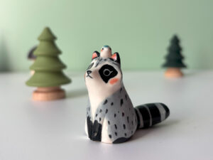 porcelain raccoon figurine cute
