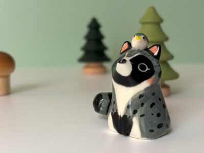 porcelain raccoon figurine cute