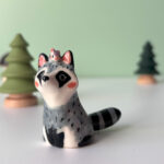 porcelain raccoon figurine cute