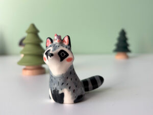 porcelain raccoon figurine cute