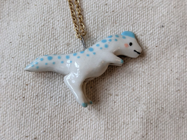 dilophosaurus pendant