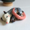 porcelain figurine handmade sleeping opossum kness