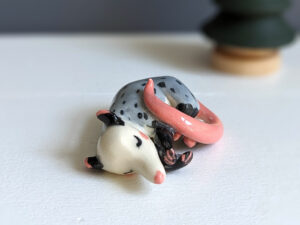 porcelain figurine handmade sleeping opossum kness