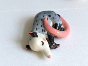 porcelain figurine handmade sleeping opossum kness