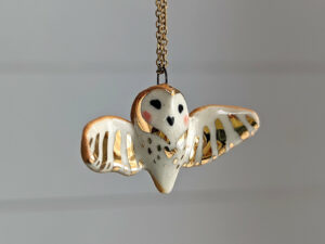 cute handmade porcelain barn owl pendant with wings out and gold