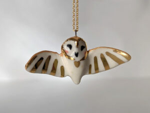 cute handmade porcelain barn owl pendant with wings out and gold