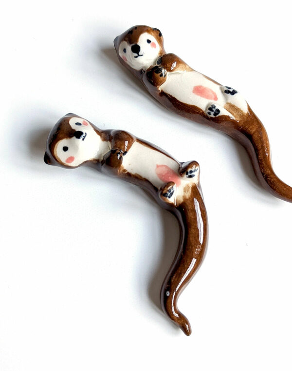 figurines couple otters